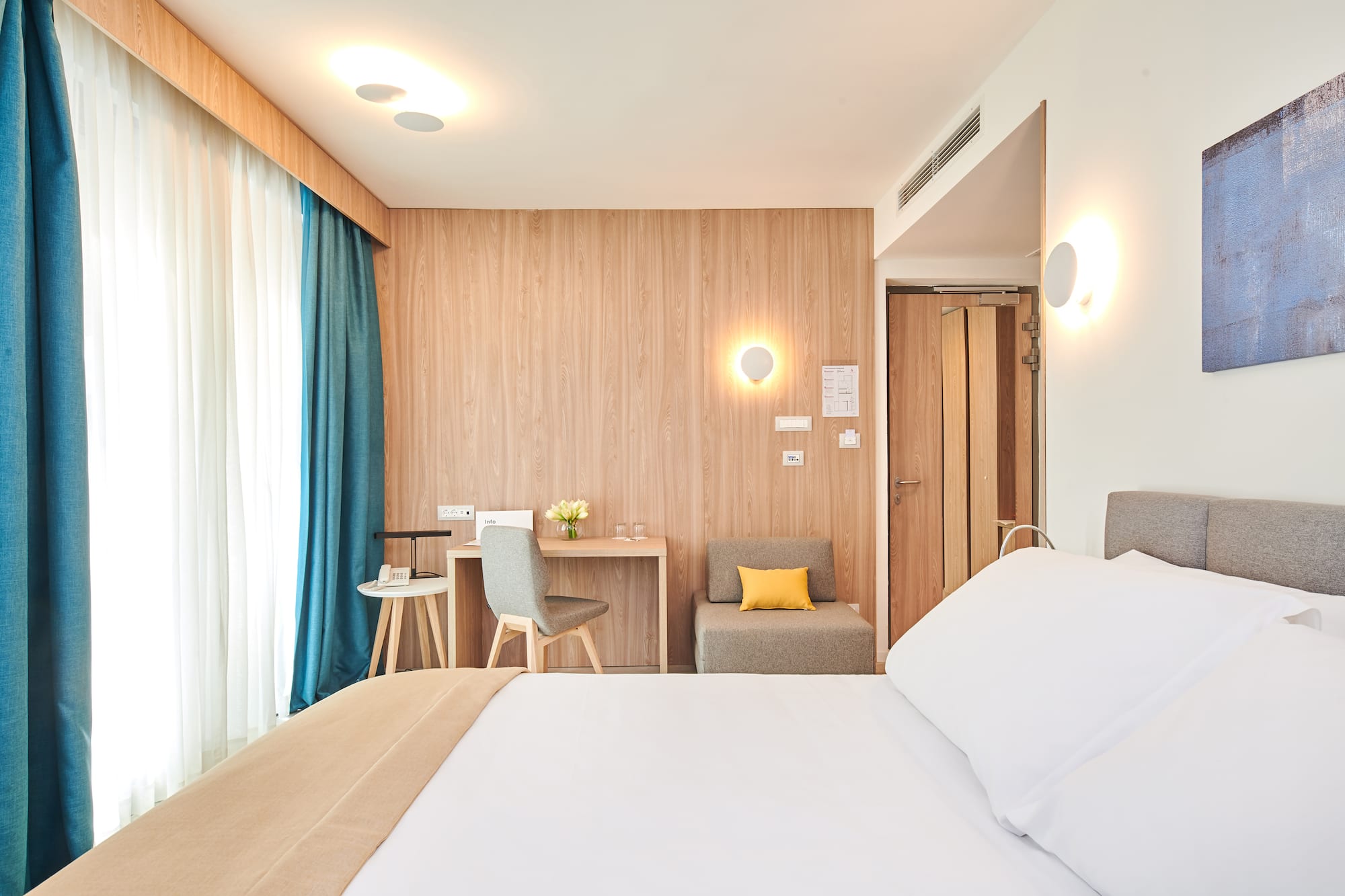 a room with a bed and a desk