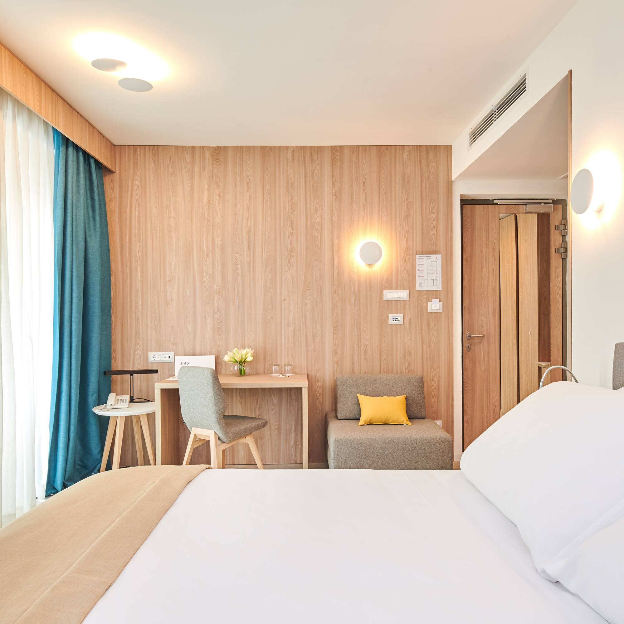 a room with a bed and a desk