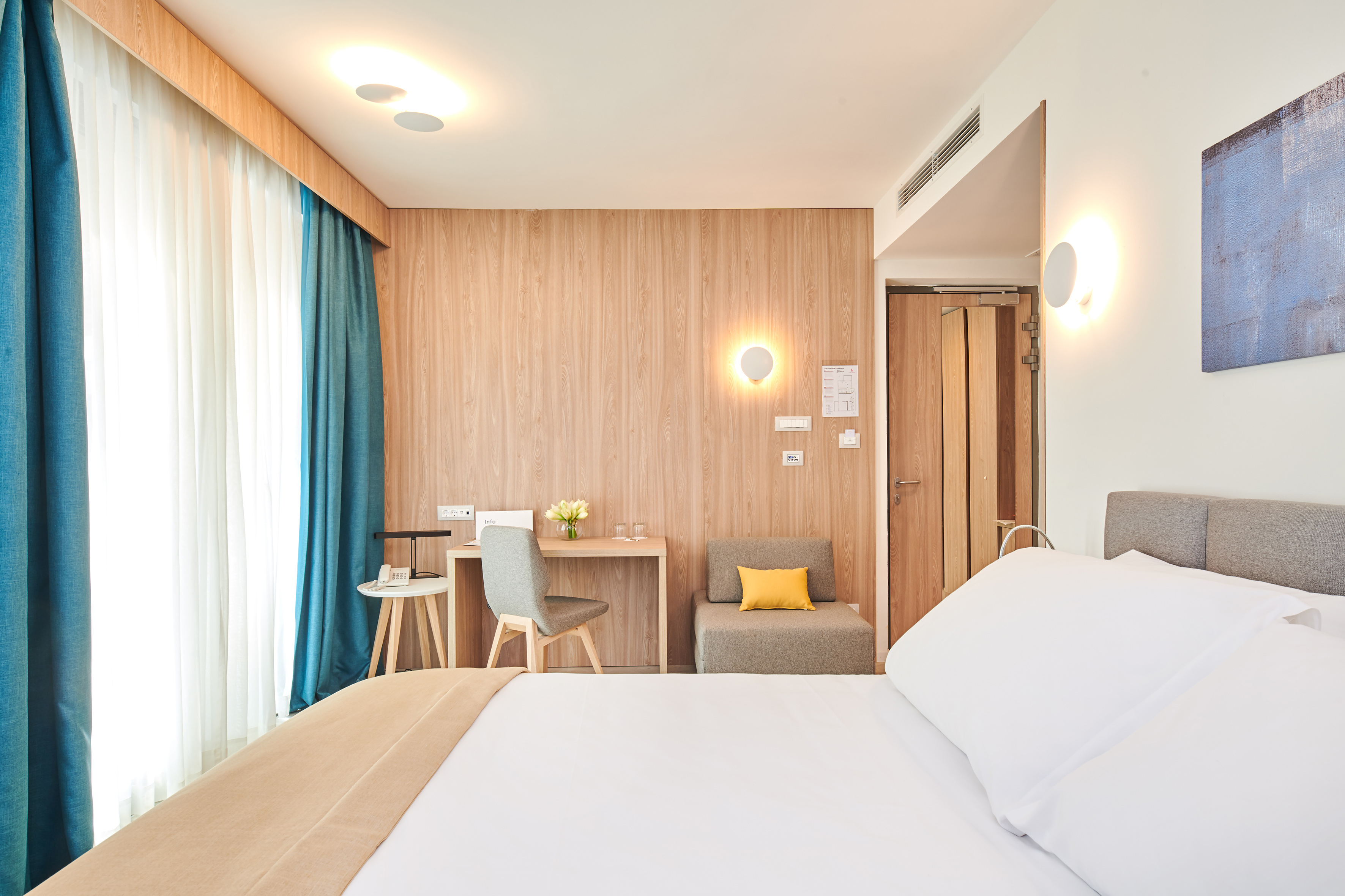 a room with a bed and a desk