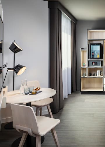 a room with a table and chairs