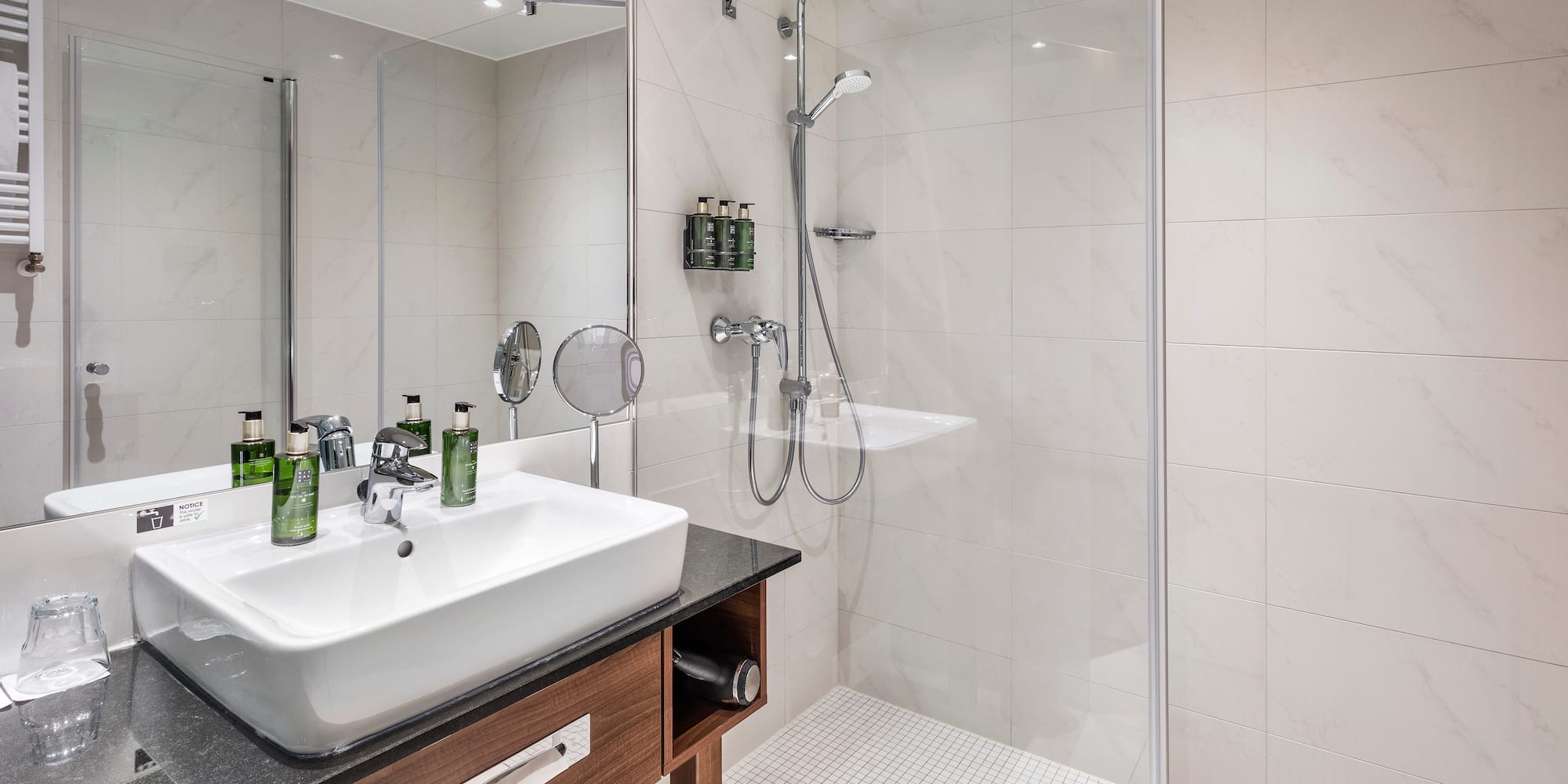 a bathroom with a shower and sink