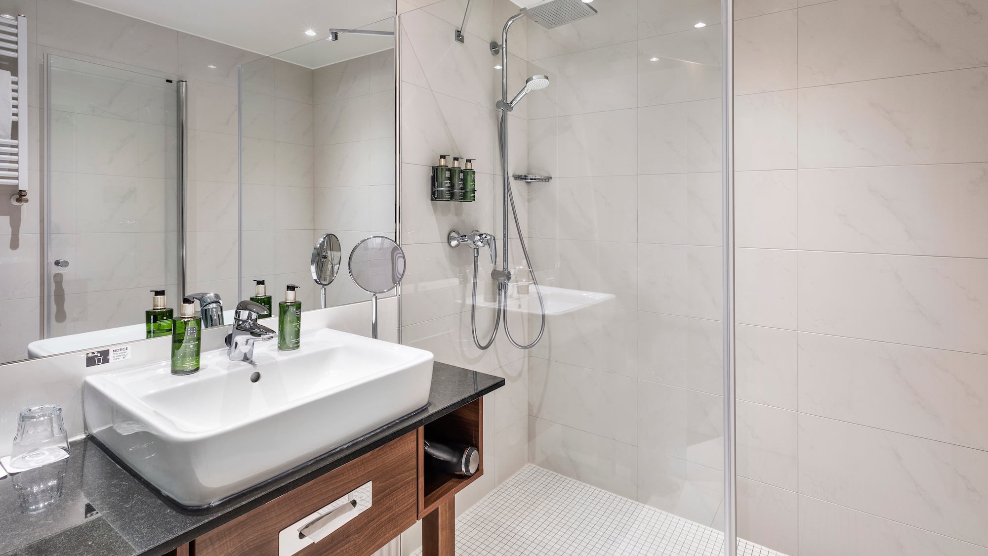 a bathroom with a shower and sink