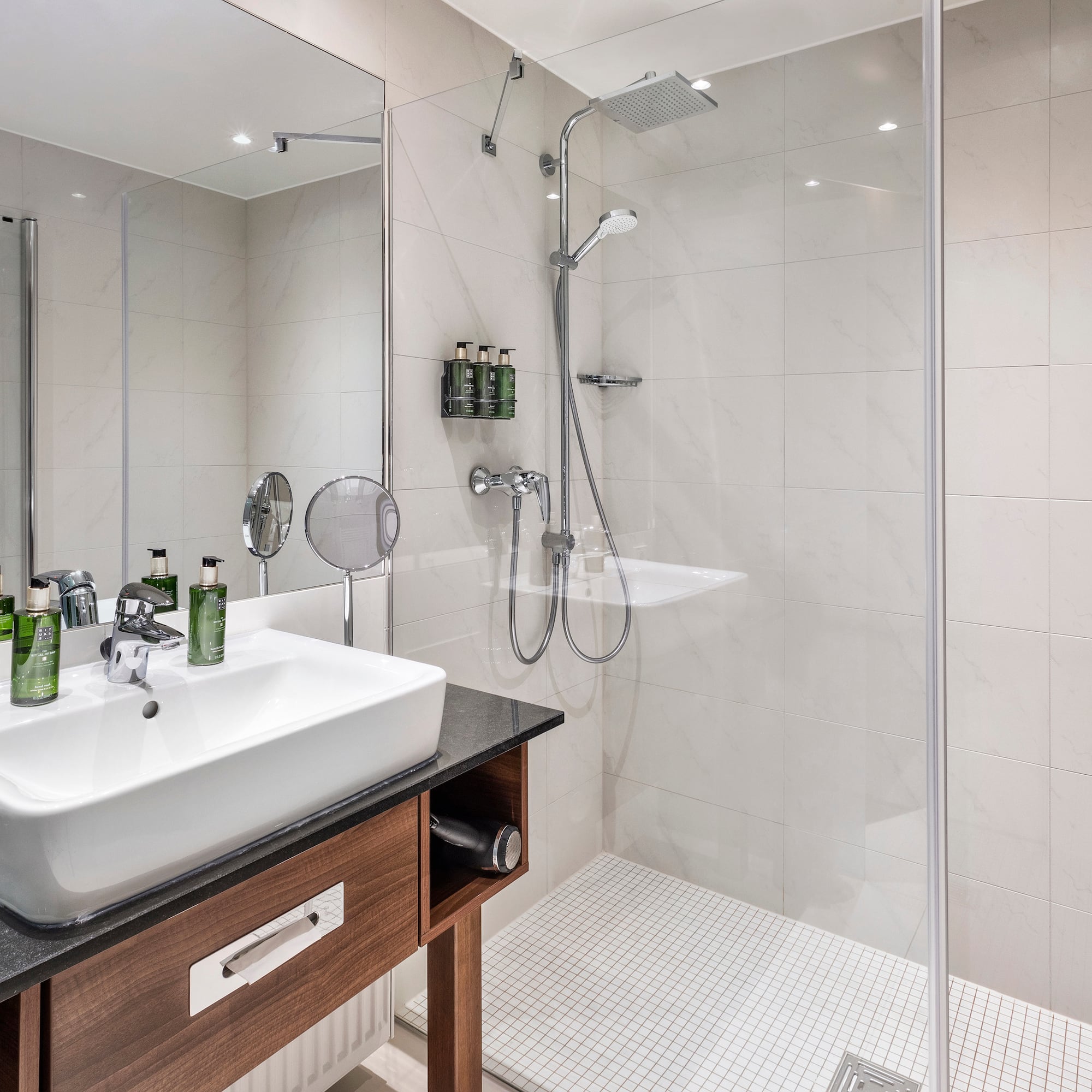 a bathroom with a shower and sink