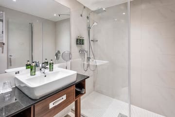 a bathroom with a shower and sink