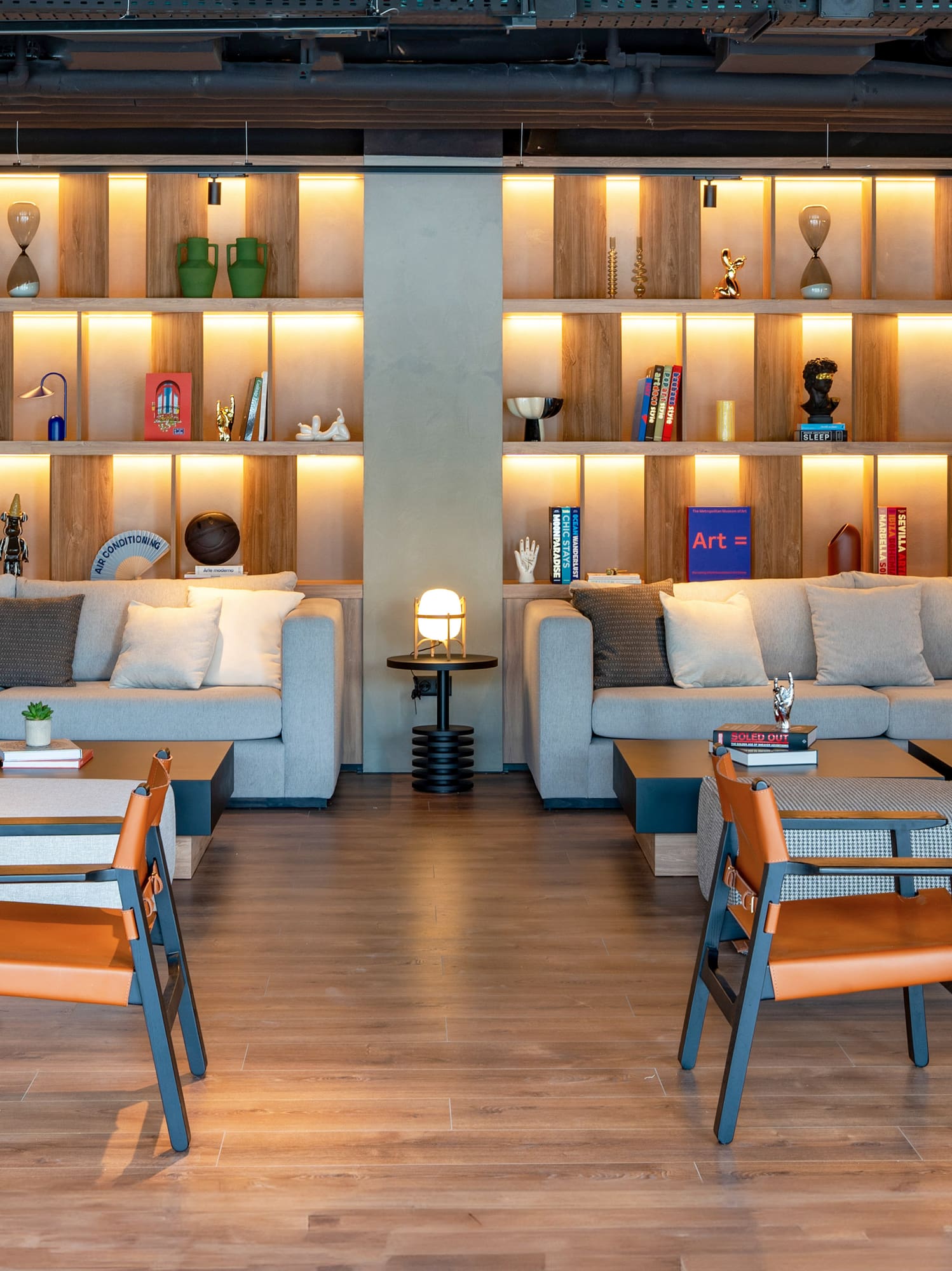 a room with a couch and chairs