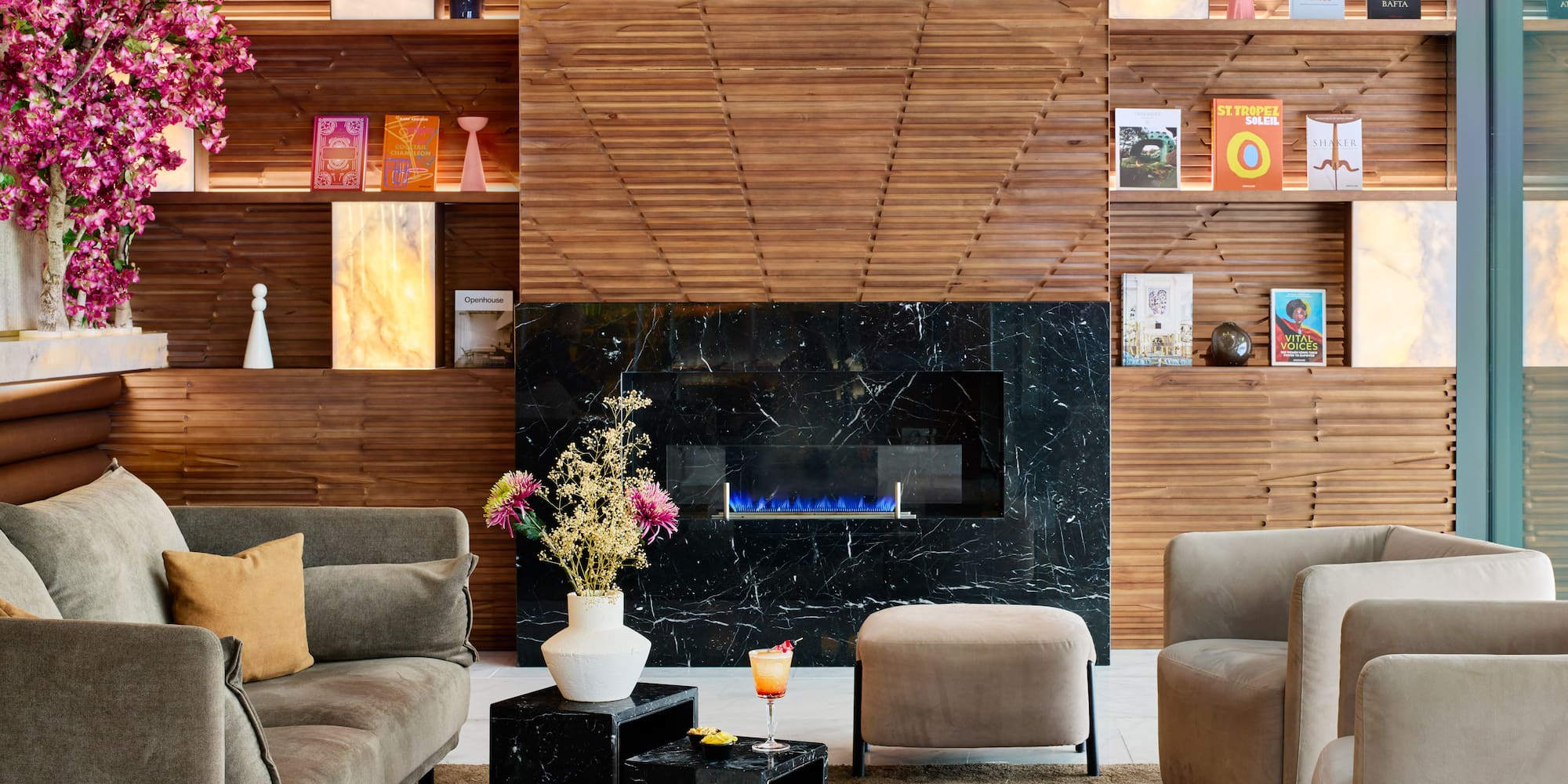 a room with a fireplace and furniture