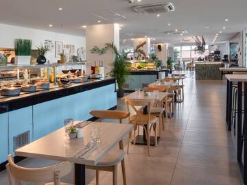 a restaurant with tables and chairs