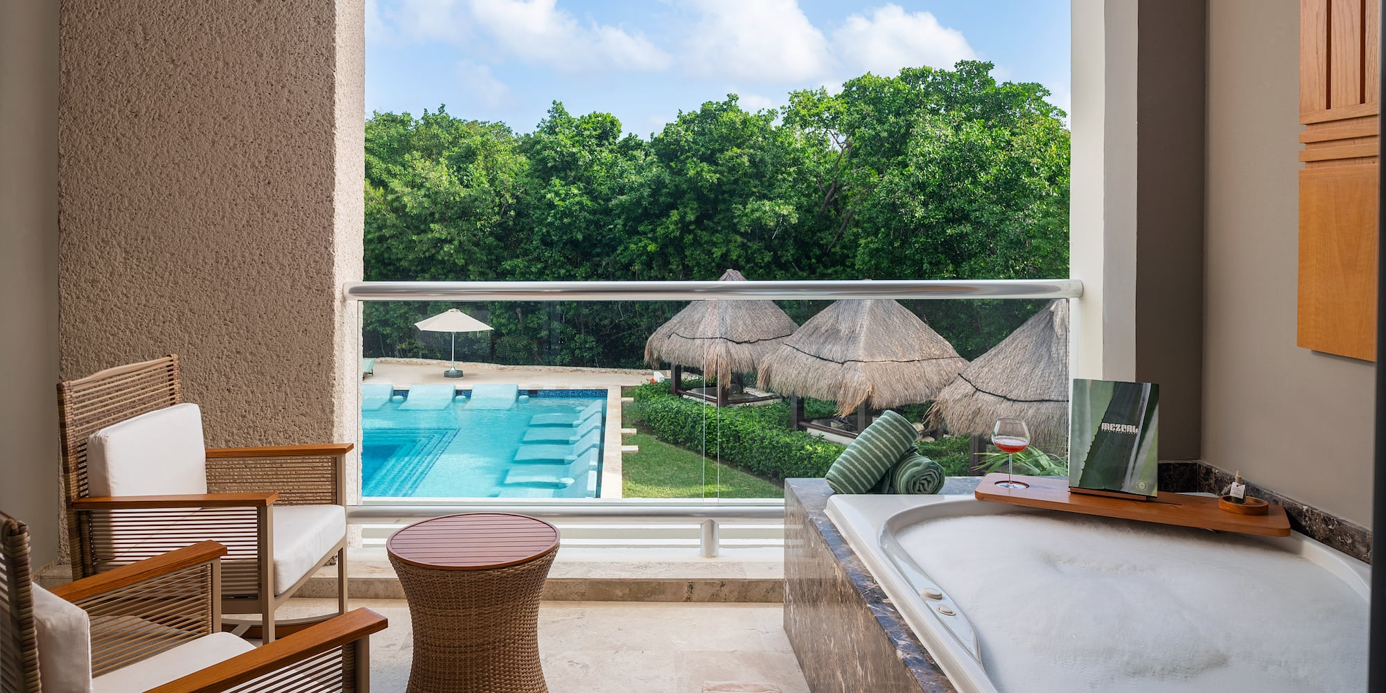 a tub and a pool outside of a room