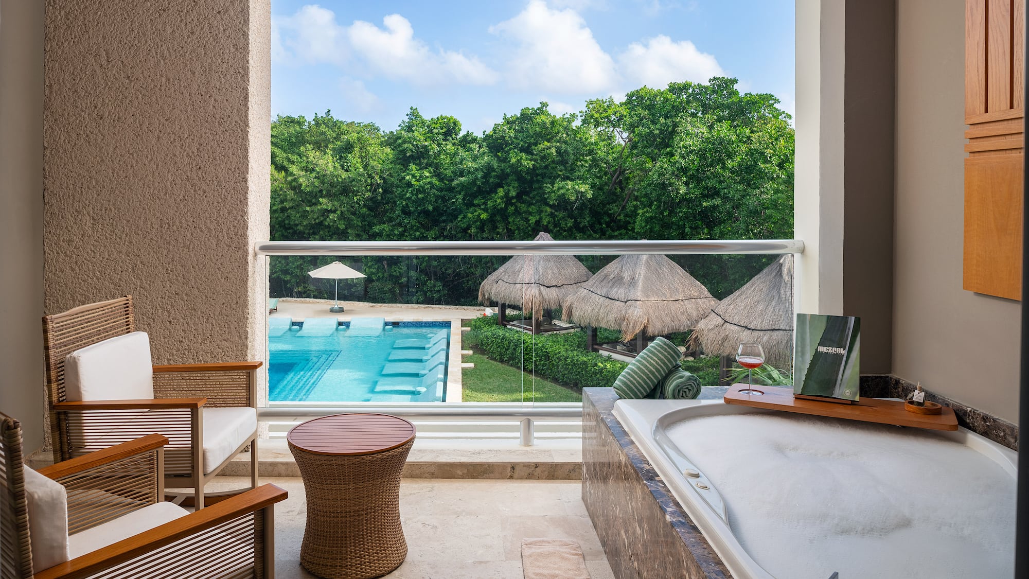 a tub and a pool outside of a room