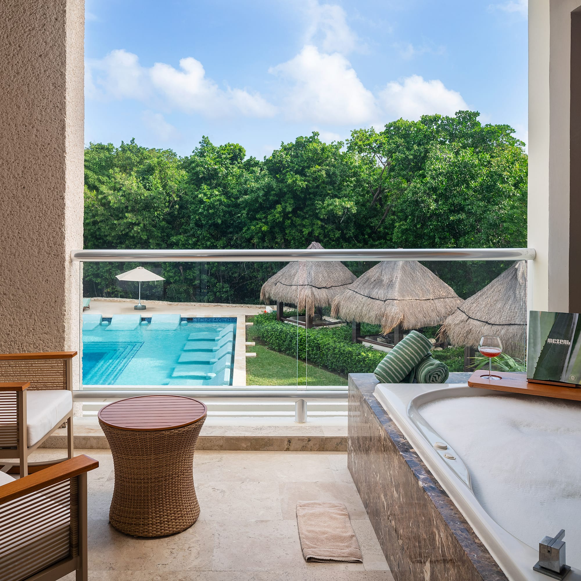 a tub and a pool outside of a room