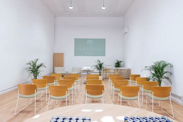 a room with chairs and tables