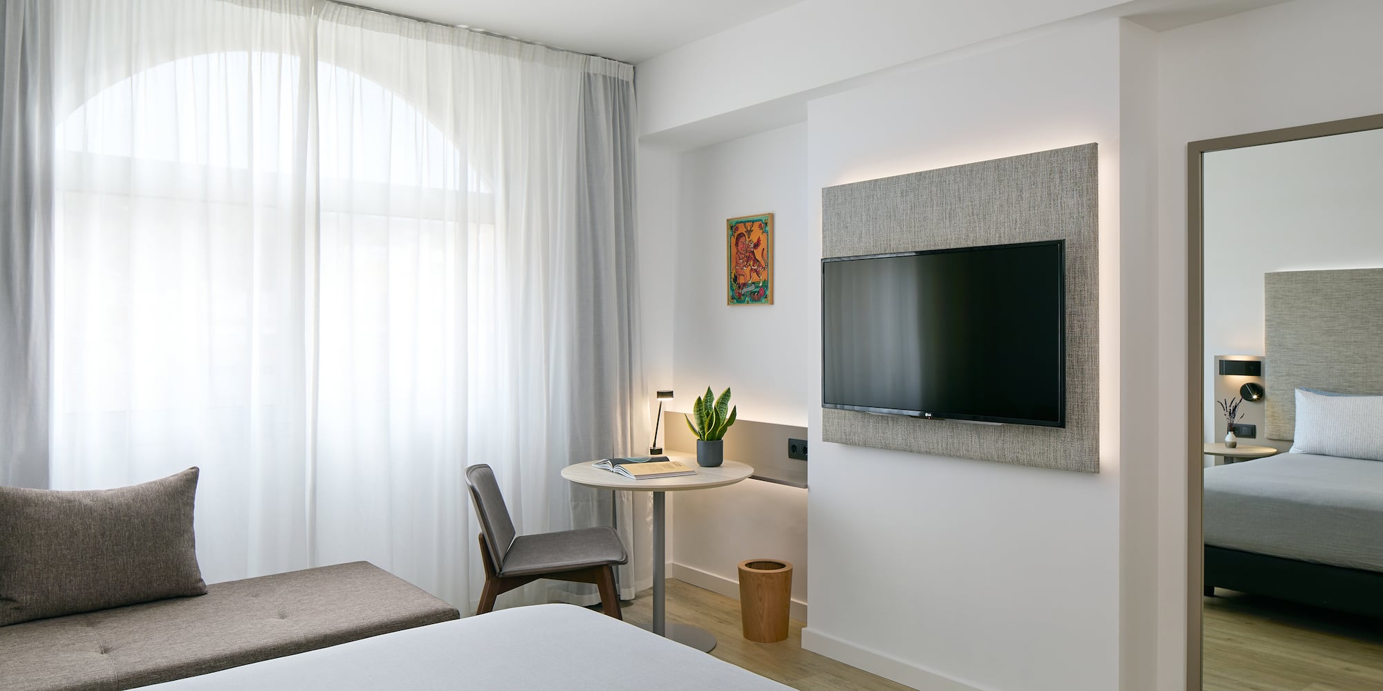 a room with a tv on the wall