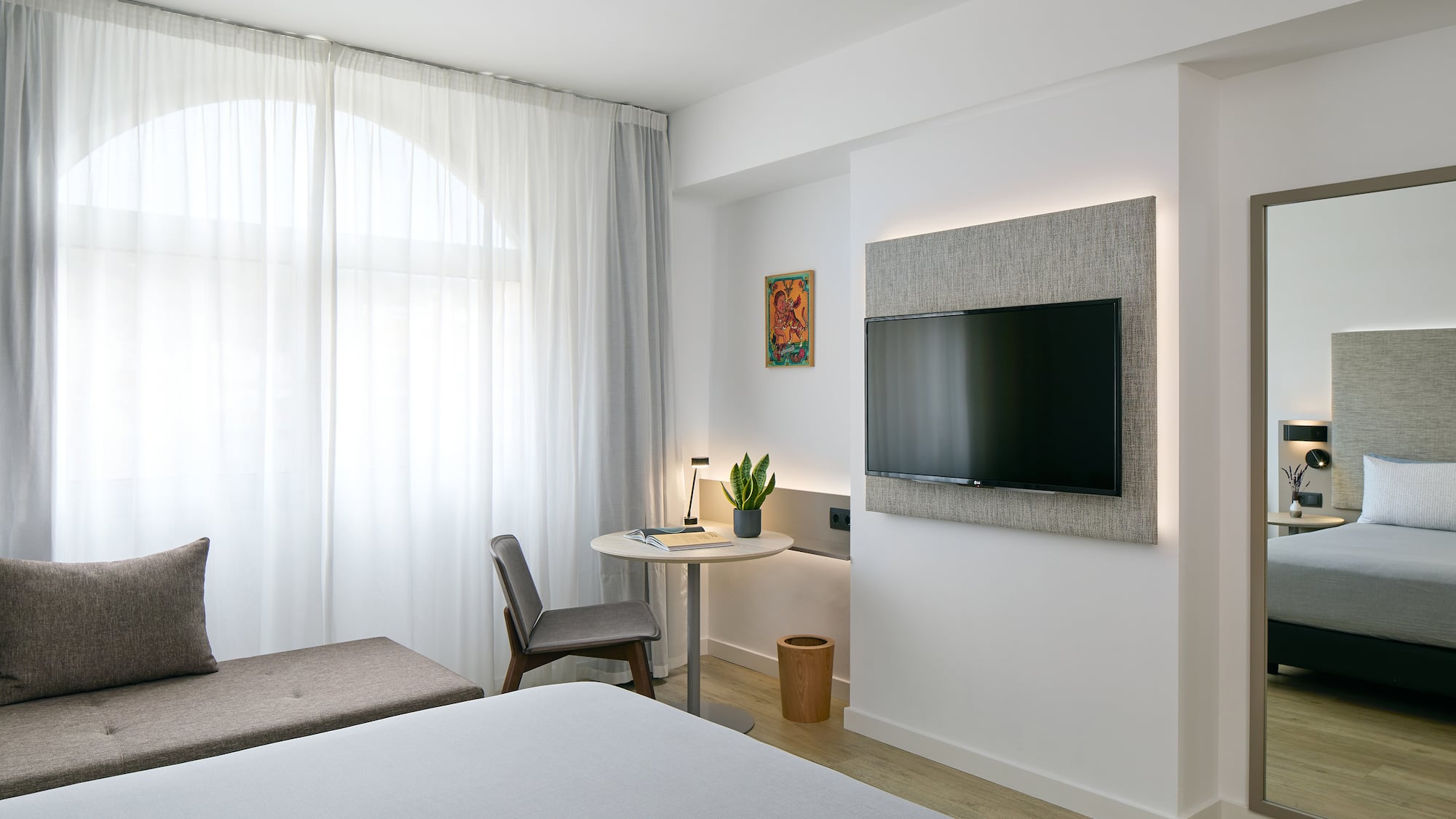 a room with a tv on the wall