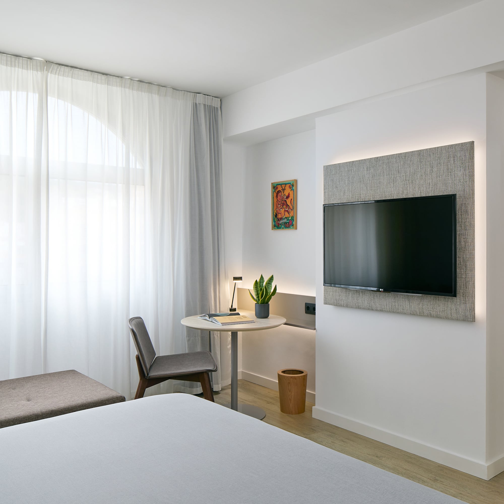 a room with a tv on the wall