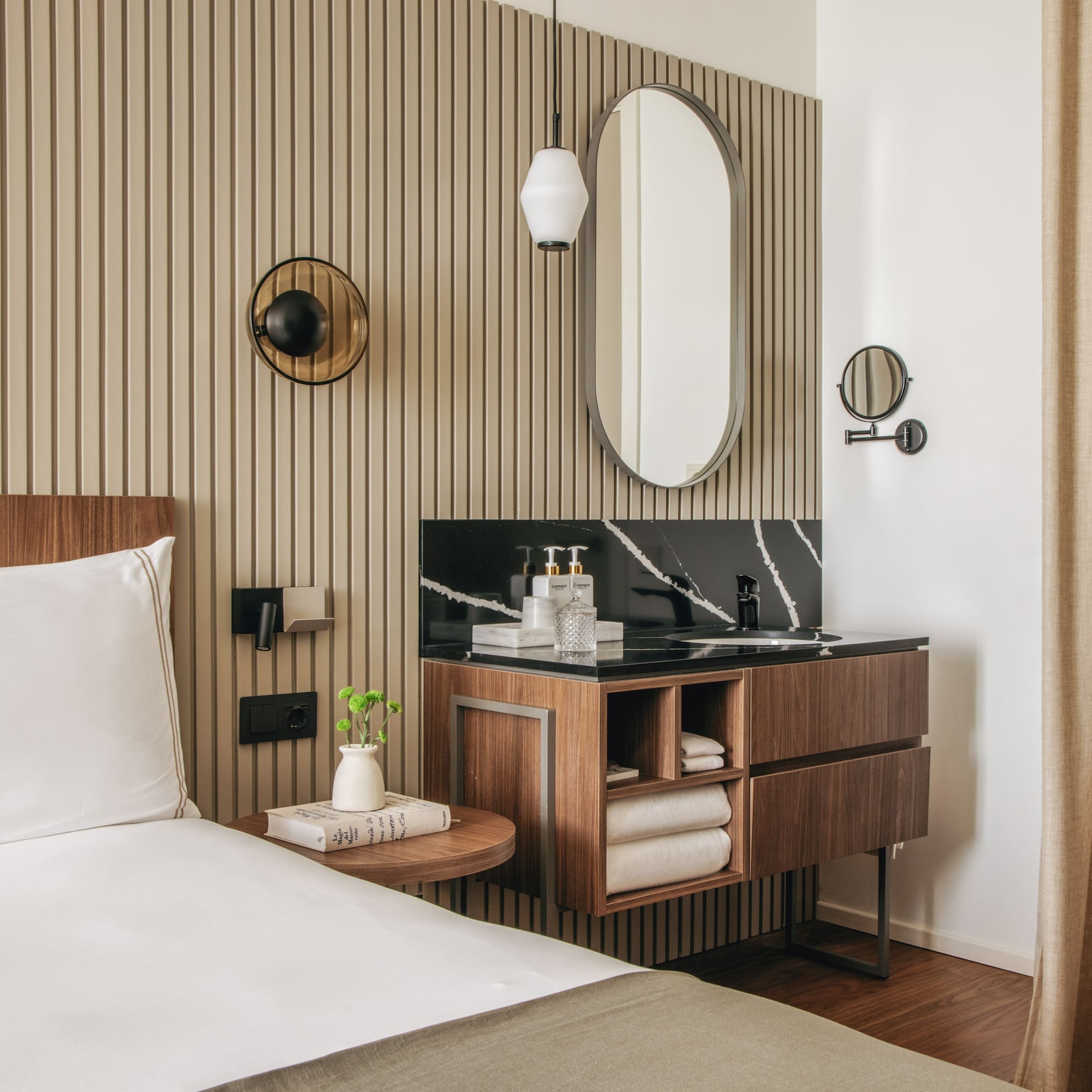 a room with a bed and a mirror