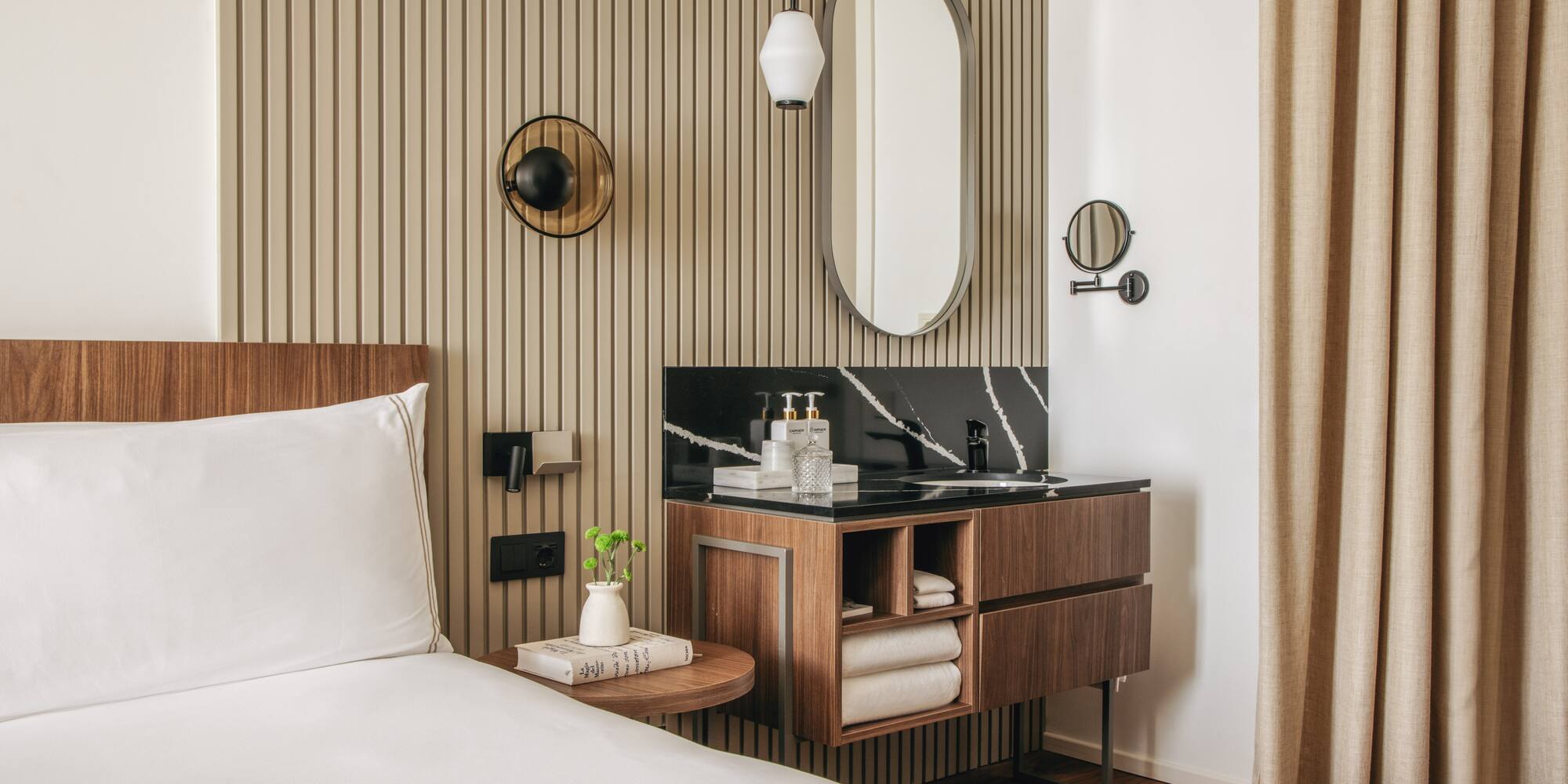 a room with a bed and a mirror