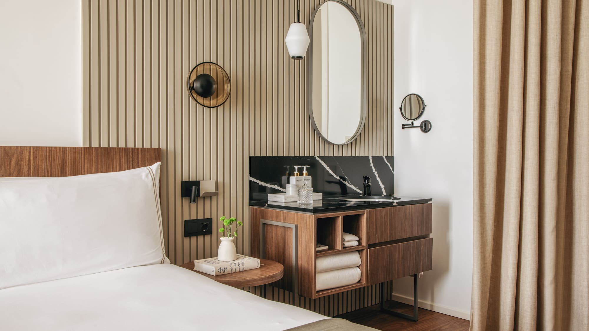 a room with a bed and a mirror