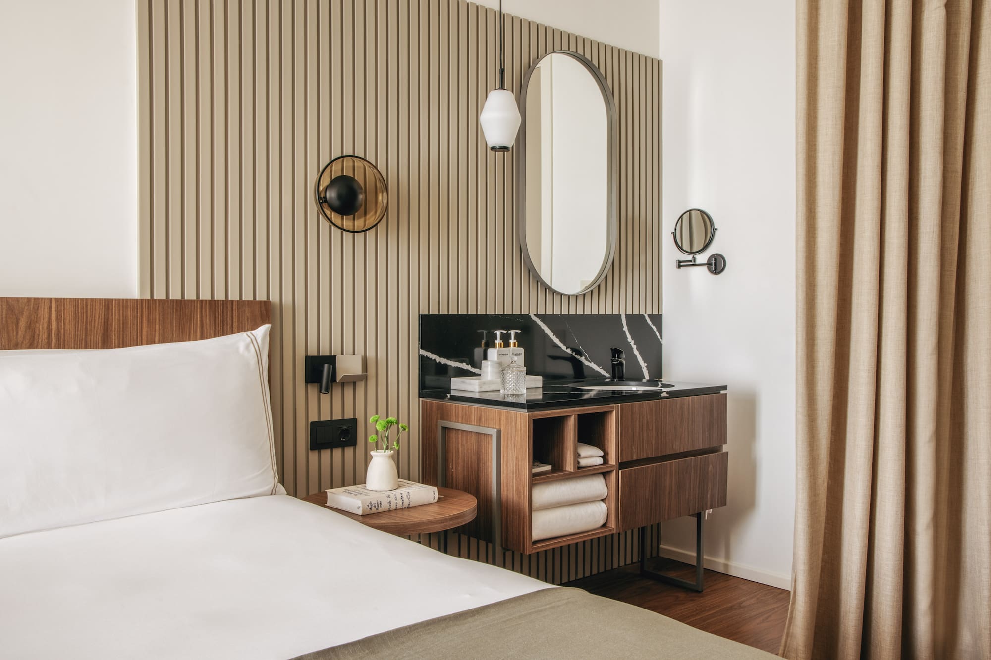 a room with a bed and a mirror