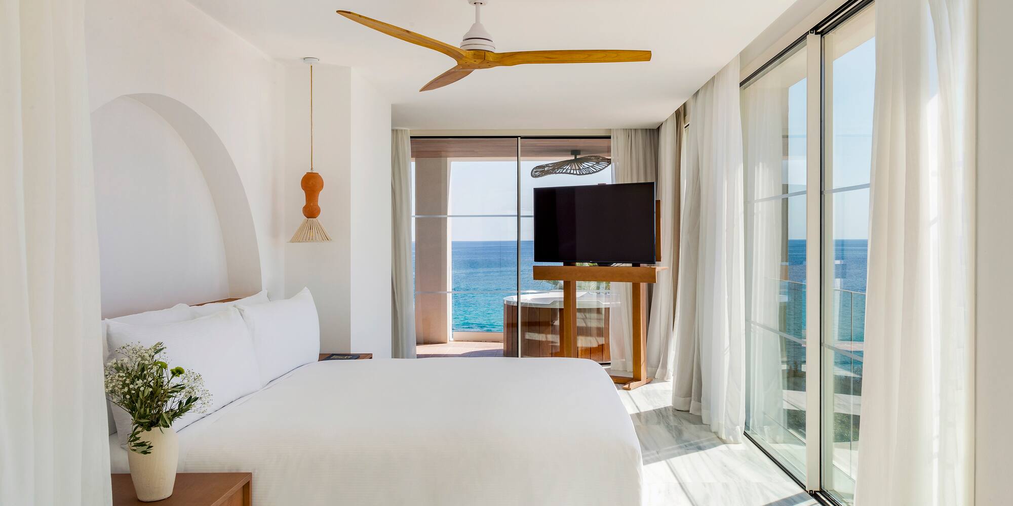 a room with a large window and a television