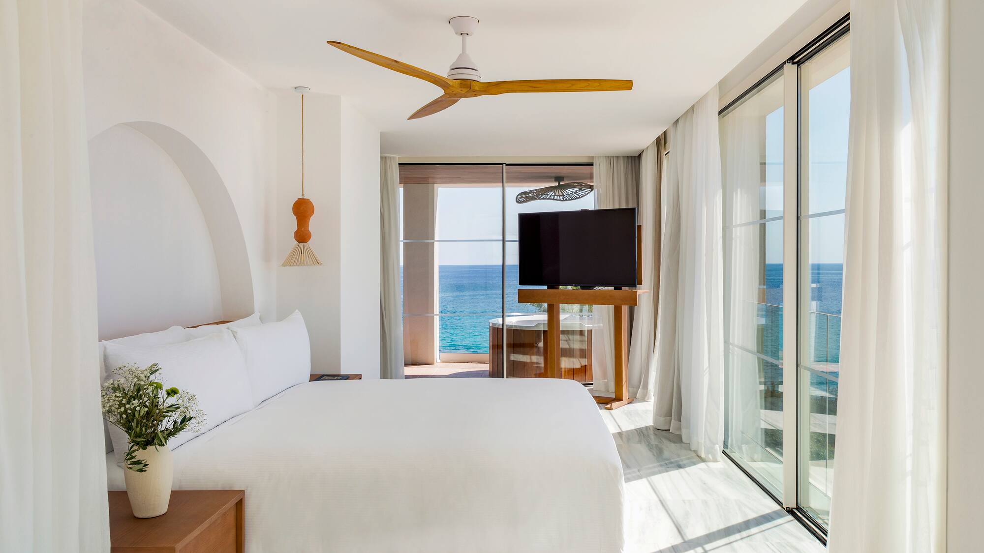 a room with a large window and a television