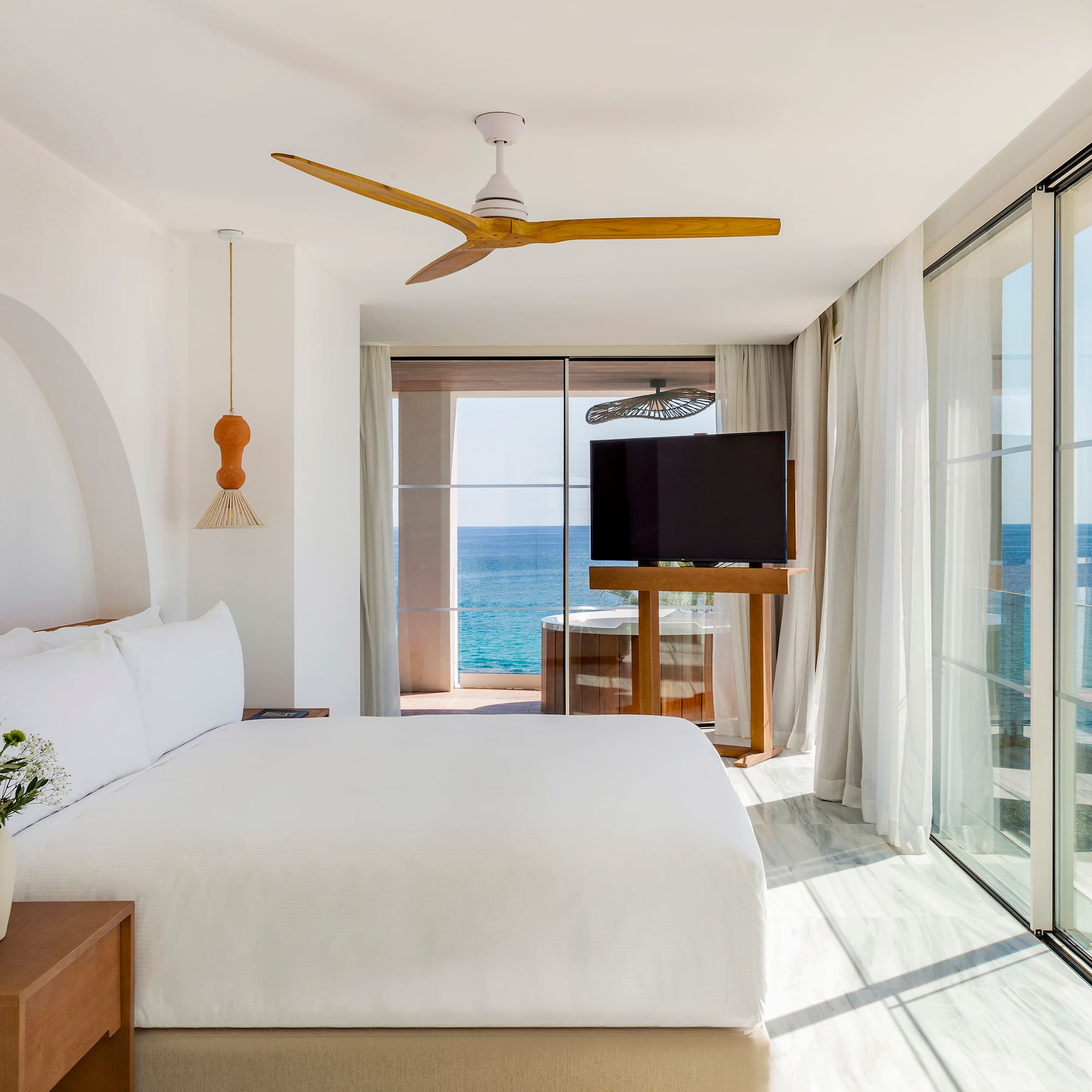 a room with a large window and a television