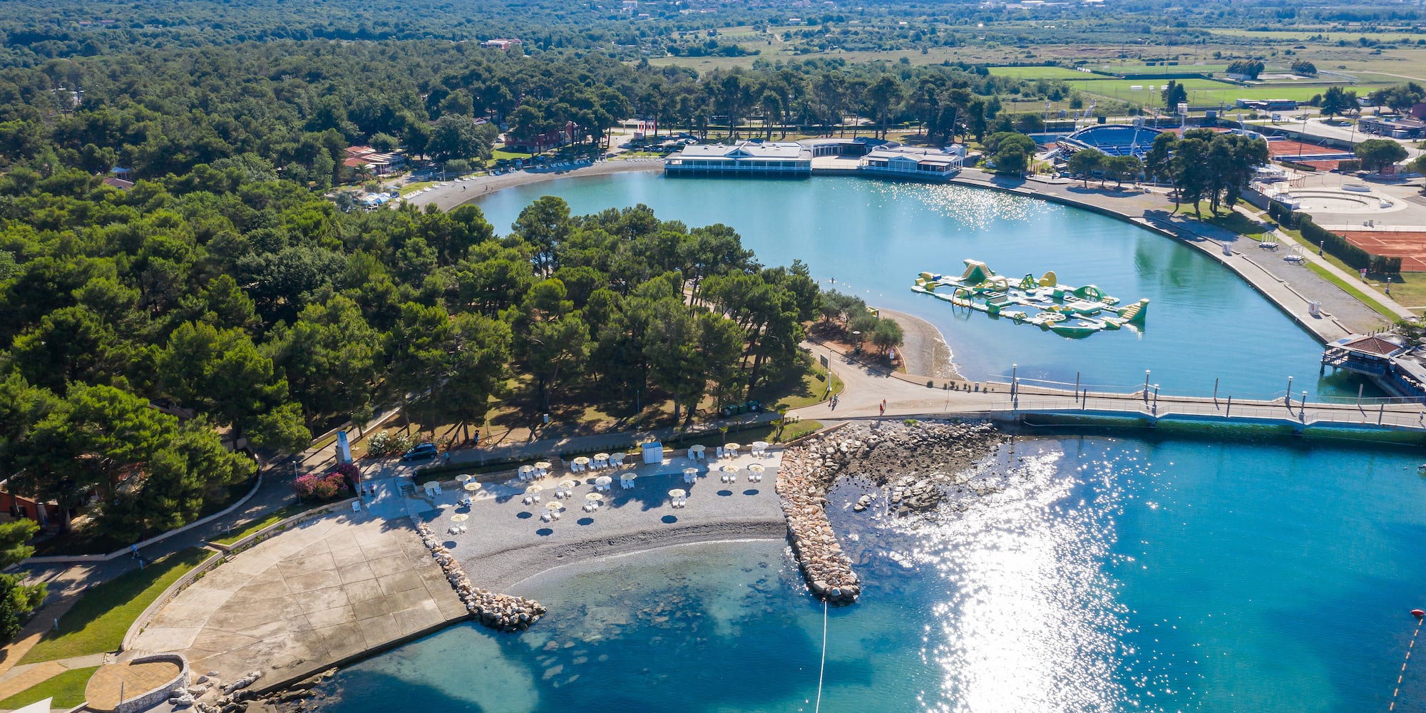 a body of water with boats and trees