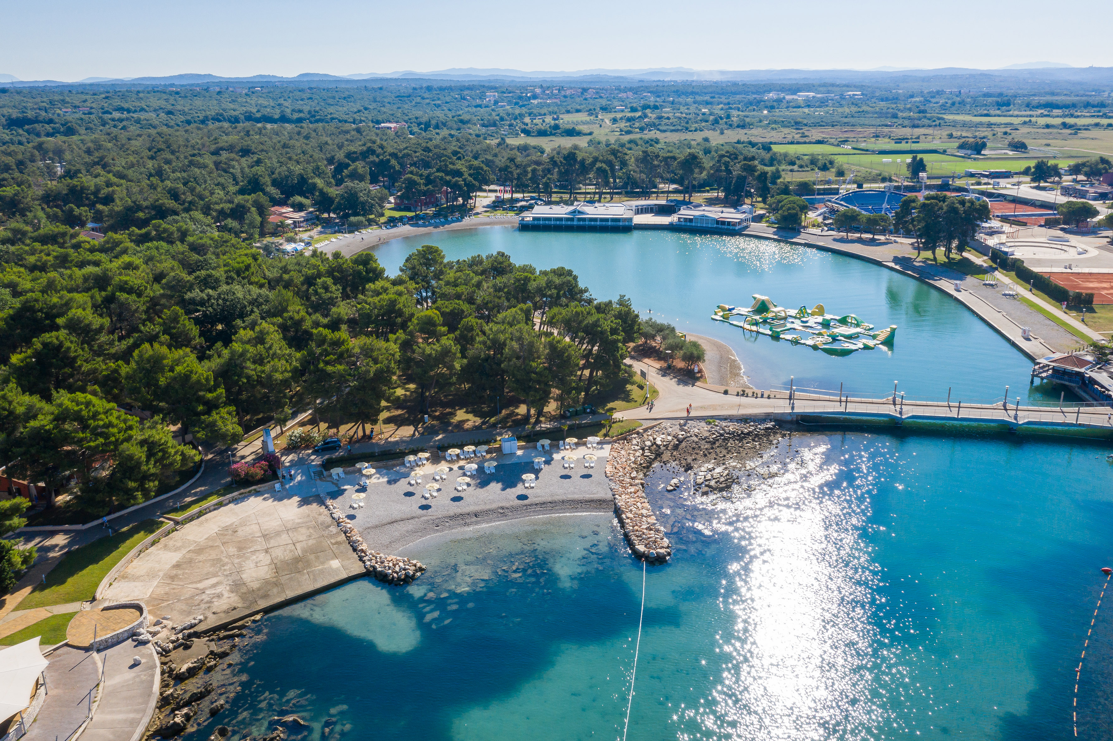a body of water with boats and trees