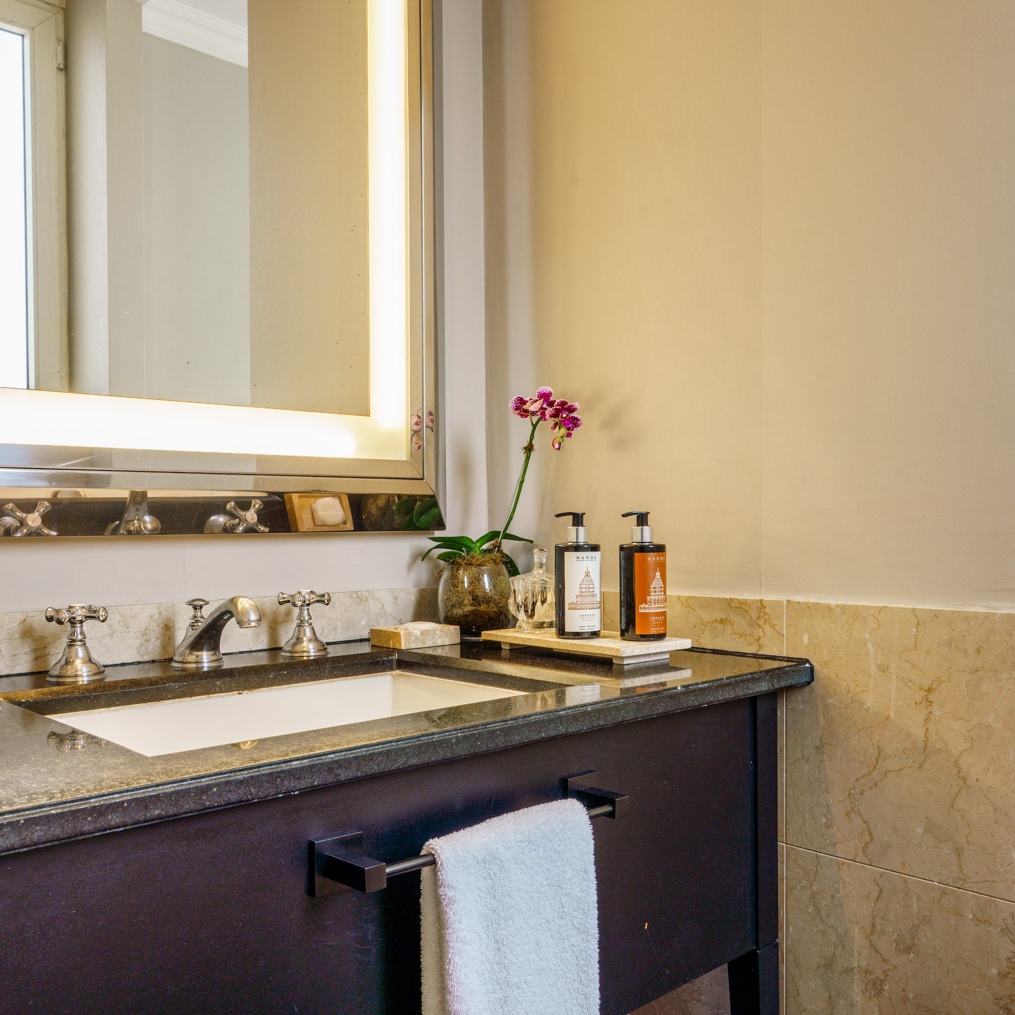 a bathroom with a mirror and sink