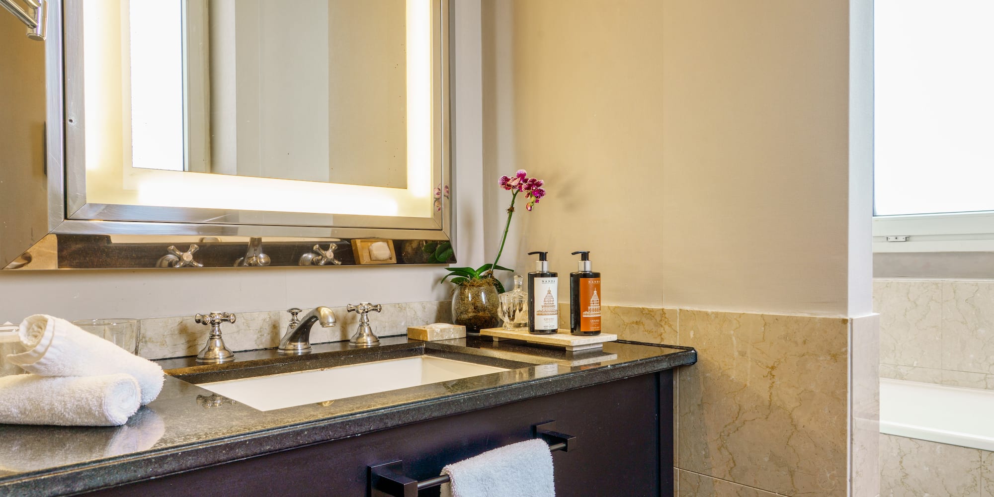 a bathroom with a mirror and sink