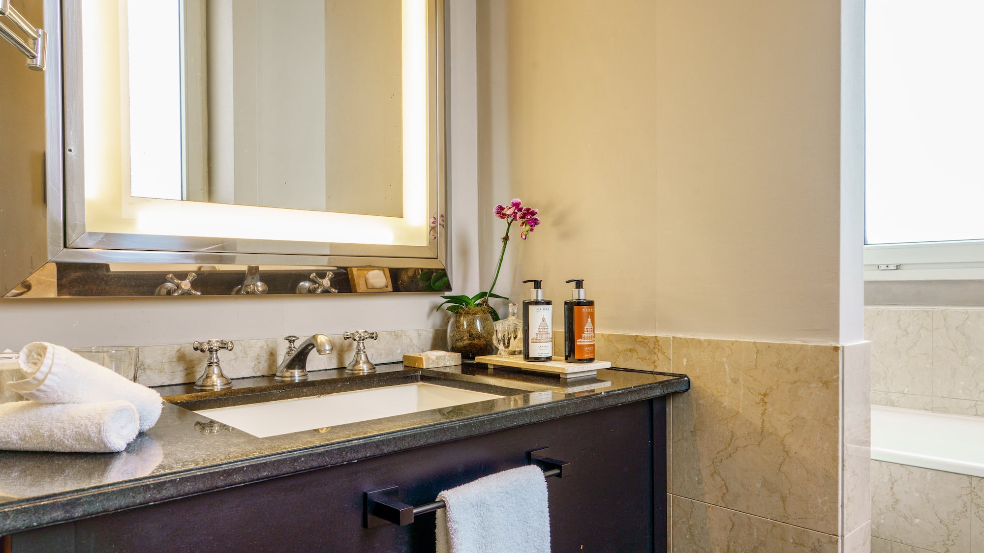a bathroom with a mirror and sink