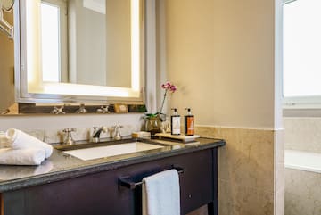 a bathroom with a mirror and sink