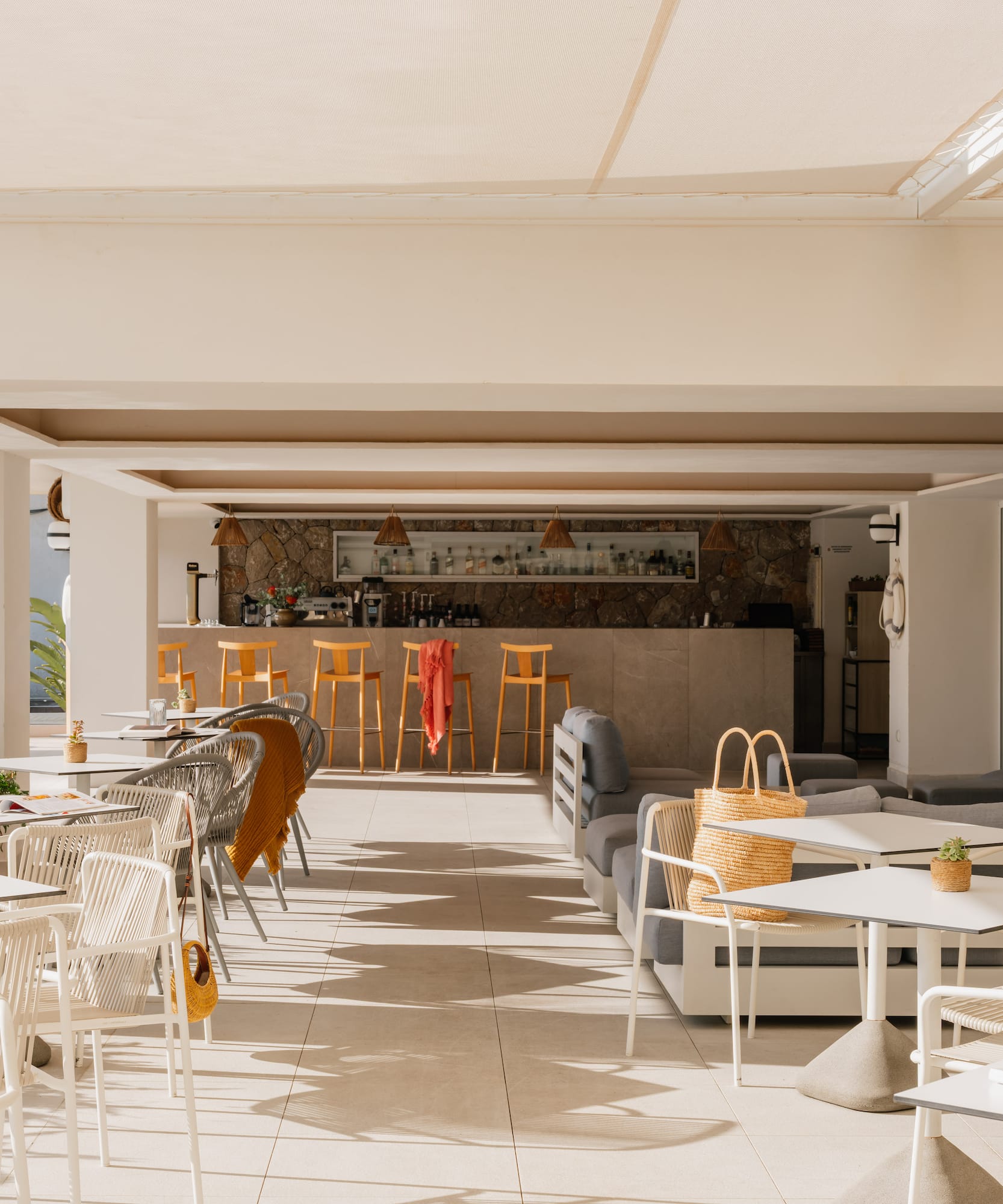 a patio with tables and chairs