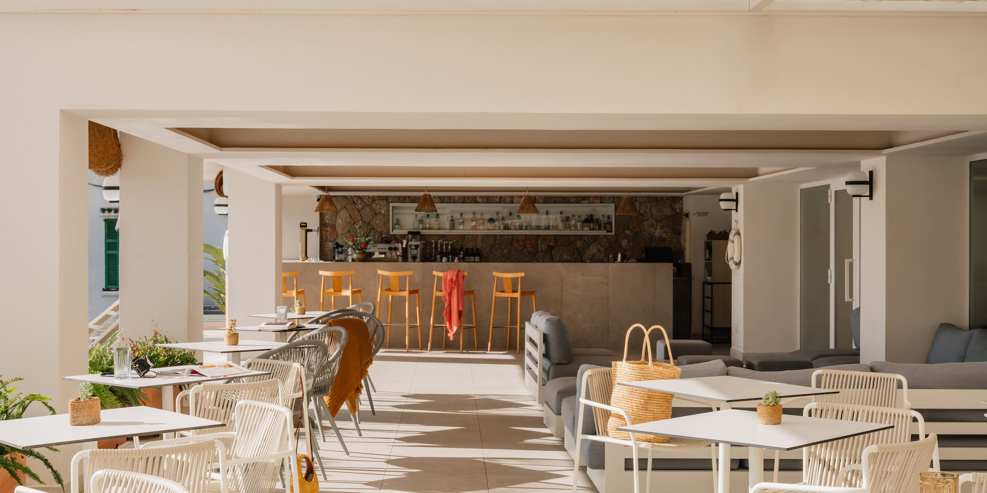a patio with tables and chairs