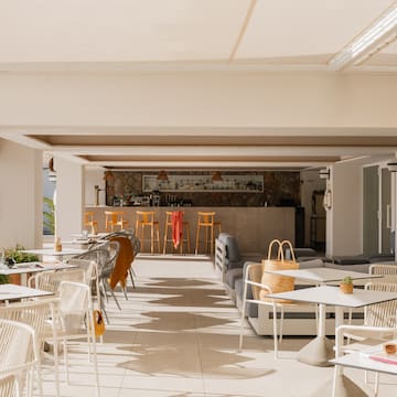 a patio with tables and chairs