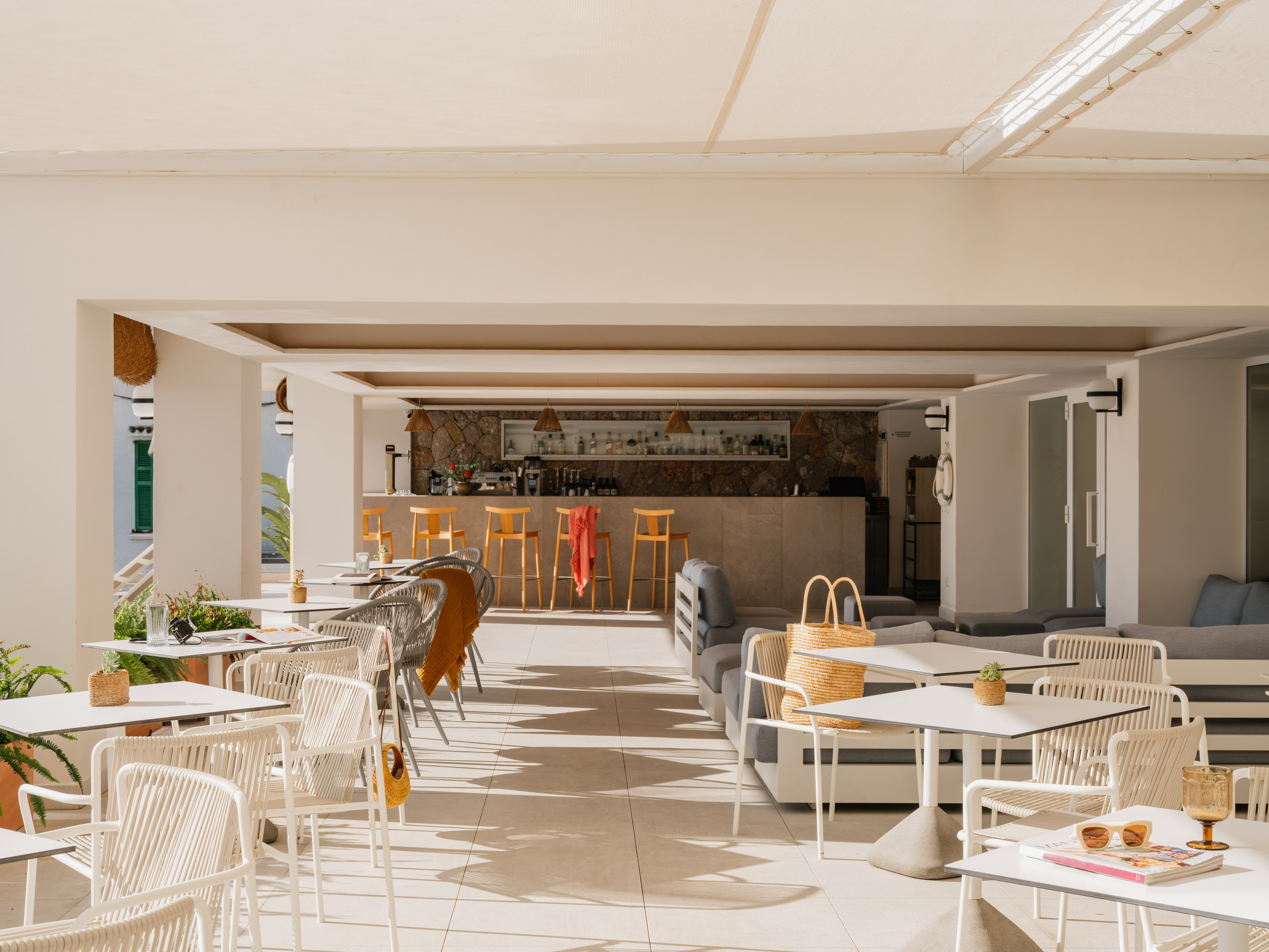a patio with tables and chairs