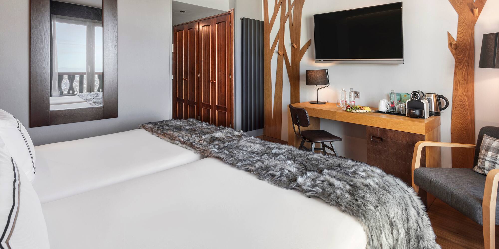 a room with a bed and a tv