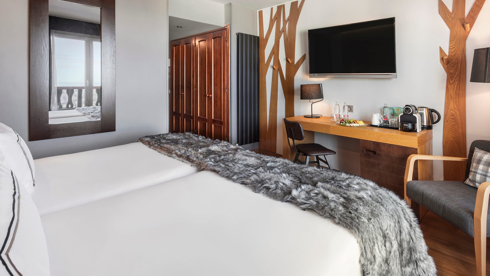 a room with a bed and a tv