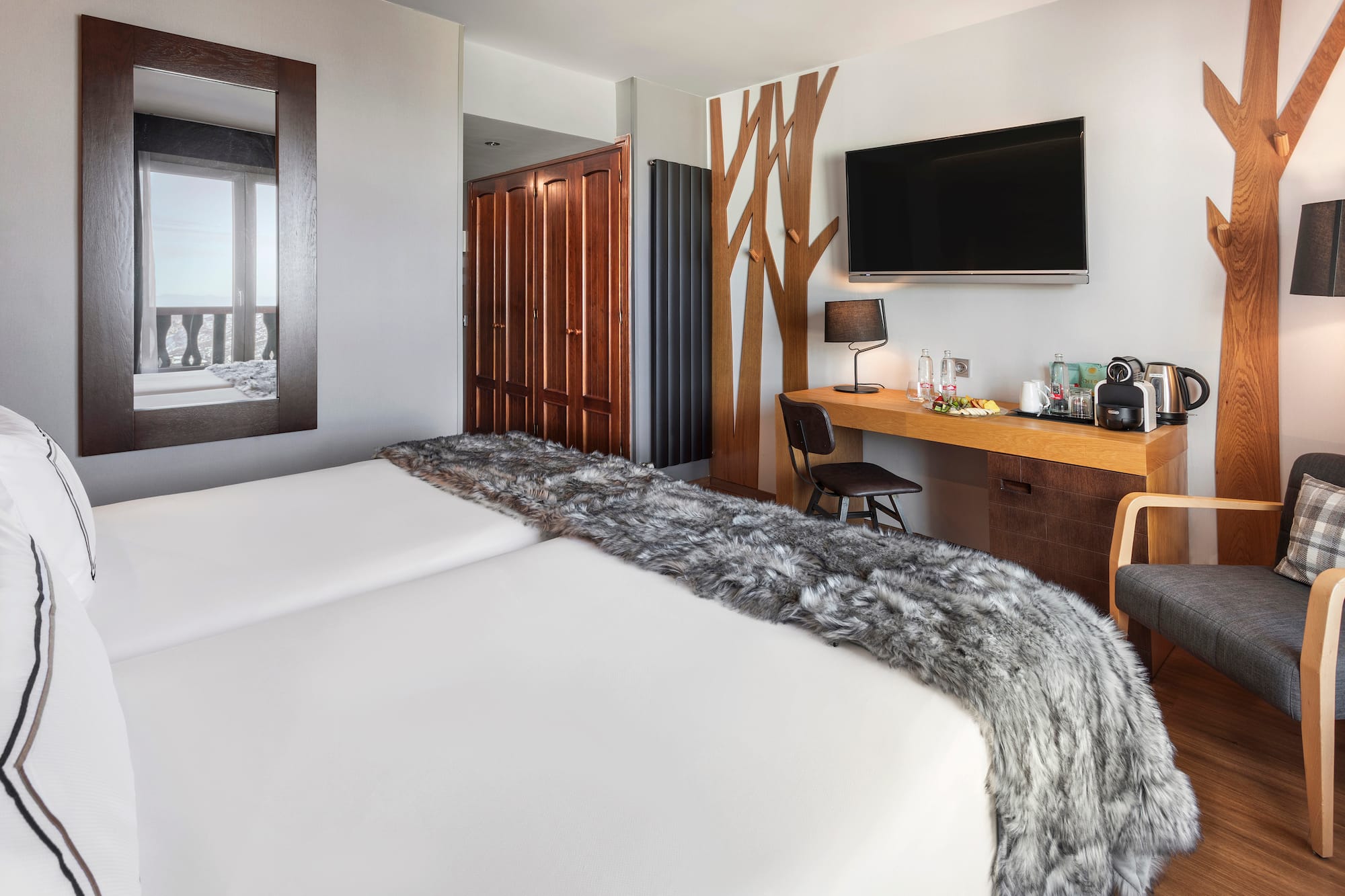 a room with a bed and a tv