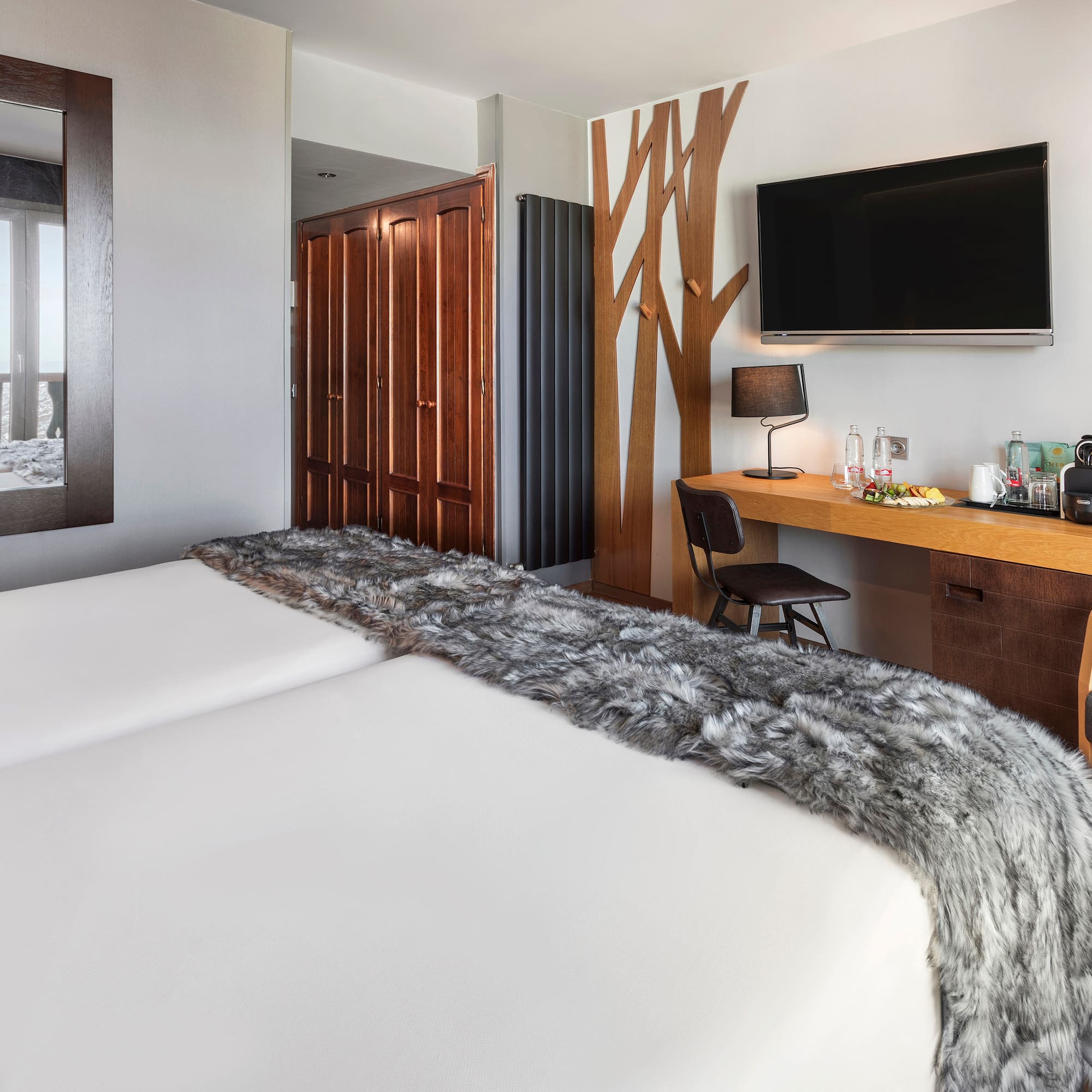 a room with a bed and a tv