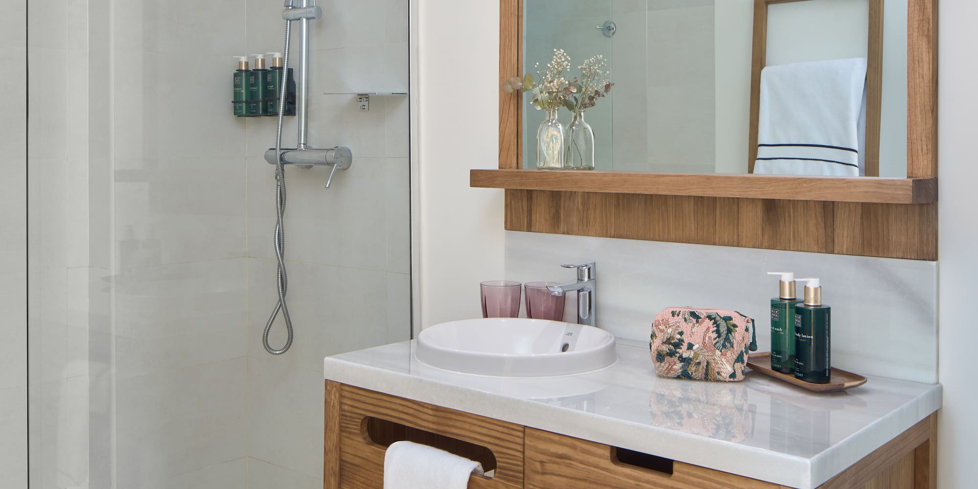 a bathroom with a mirror and a sink