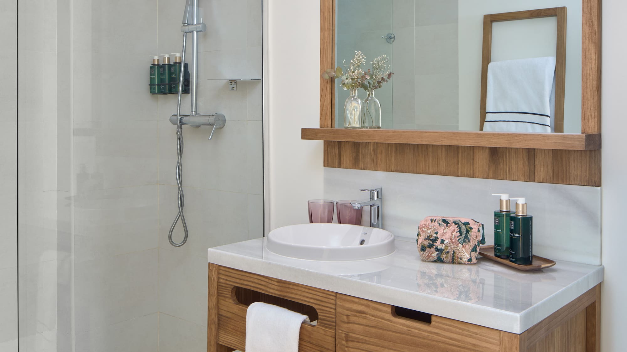 a bathroom with a mirror and a sink