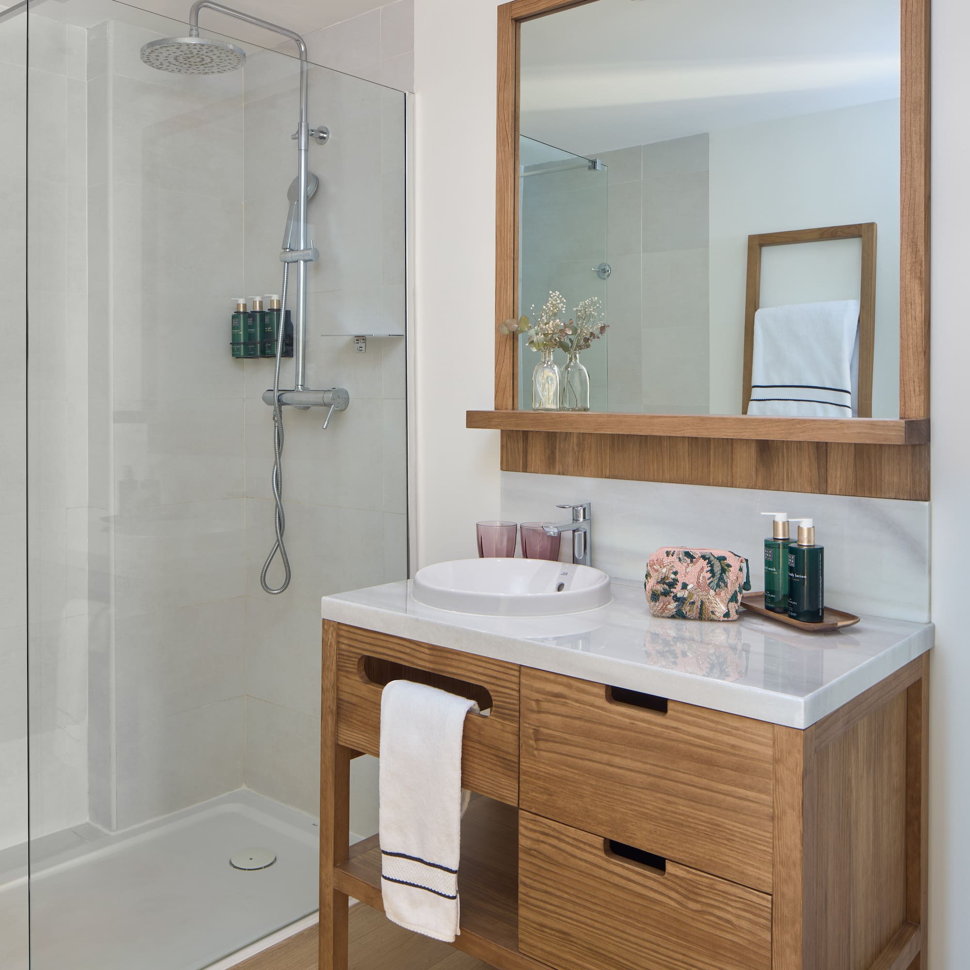 a bathroom with a mirror and a sink