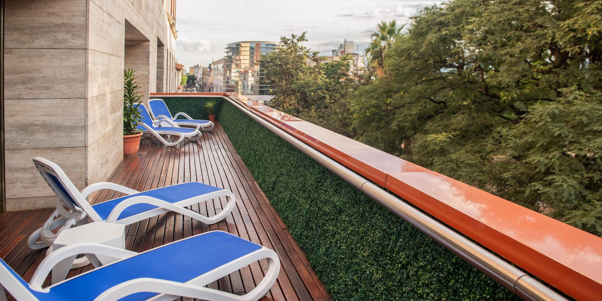 a deck with chairs on a balcony