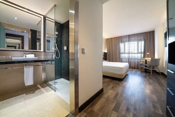 a bathroom with a shower and a bed