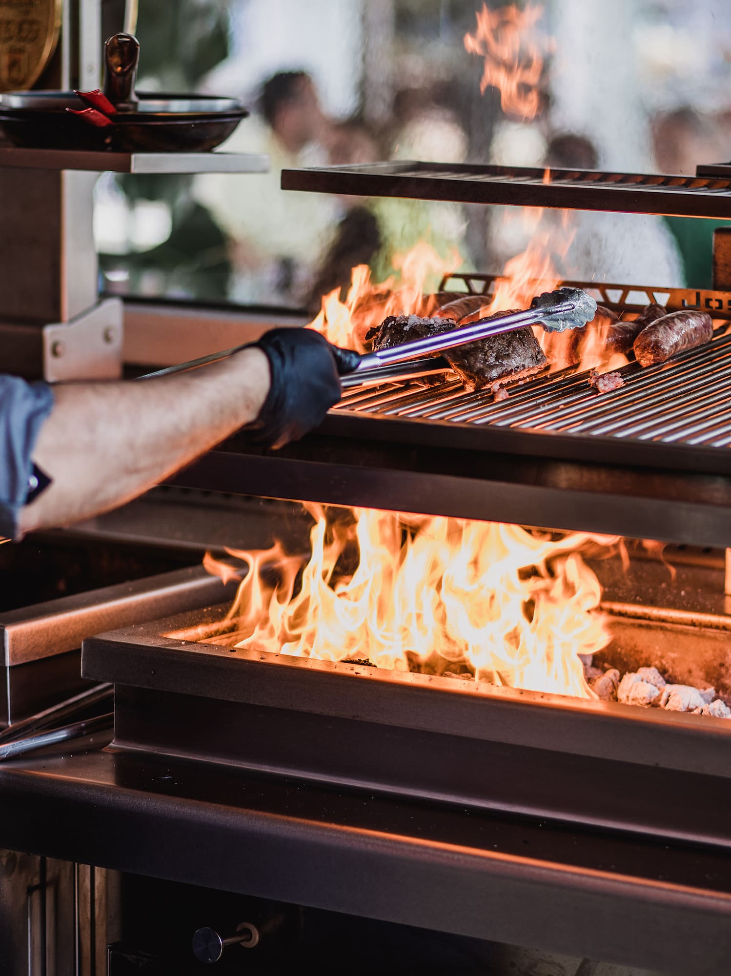 a person cooking food on a grill