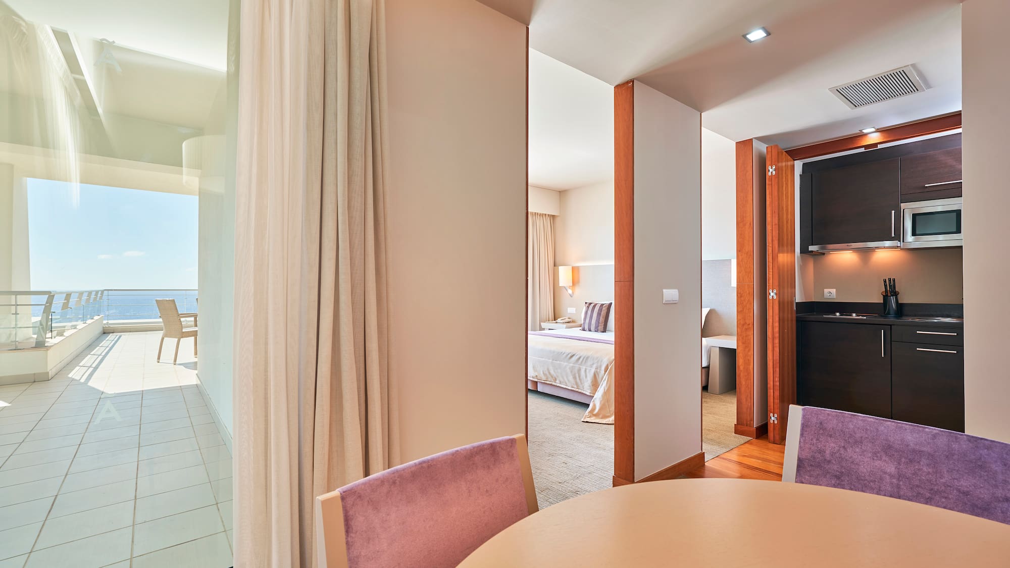 a room with a table and chairs