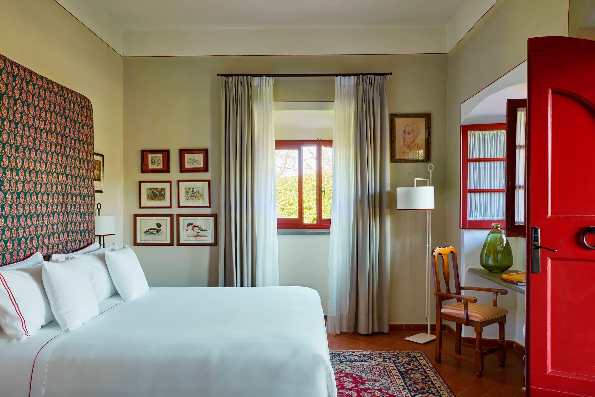 a bedroom with a bed and a chair