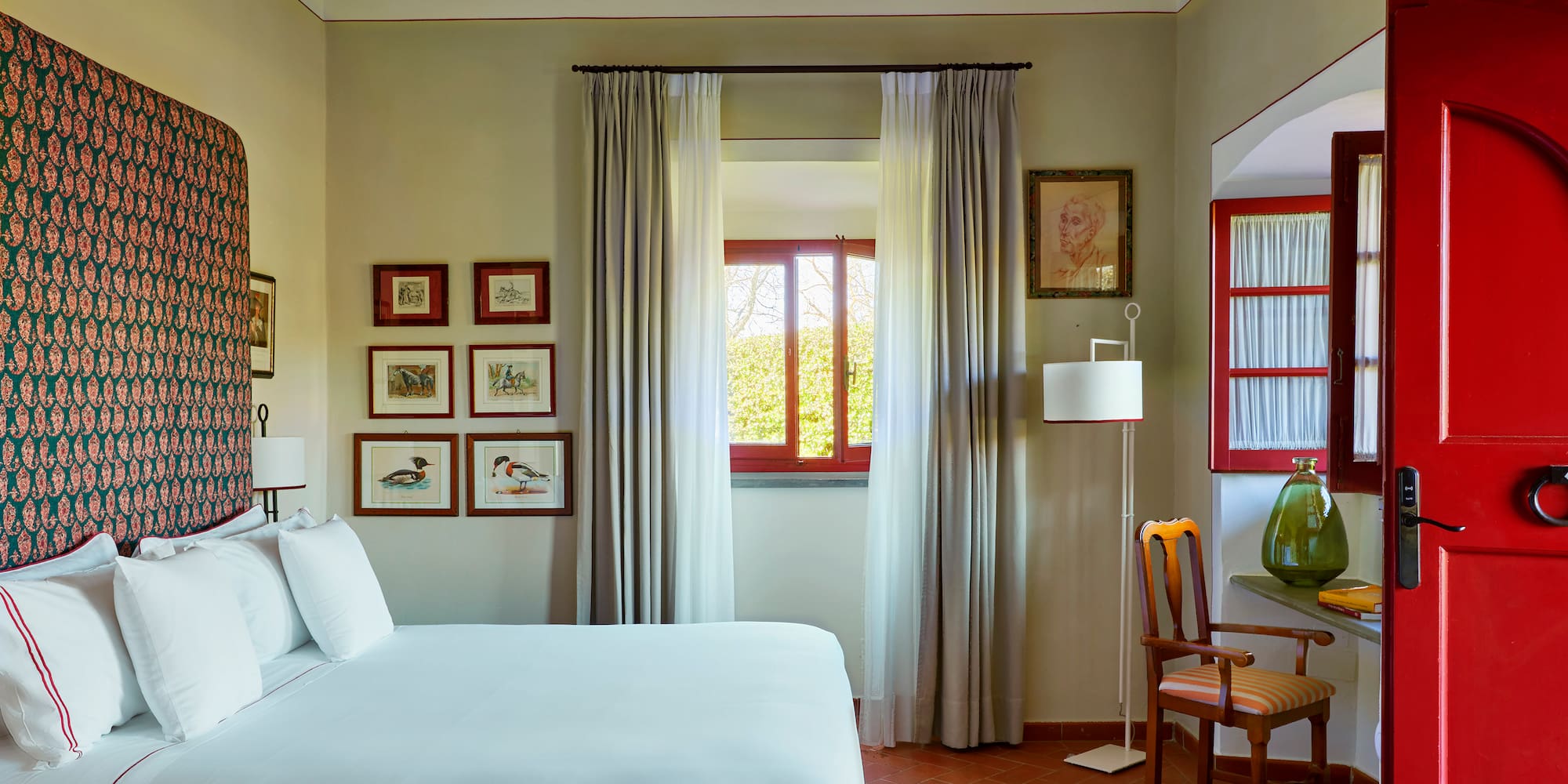 a bedroom with a bed and a chair