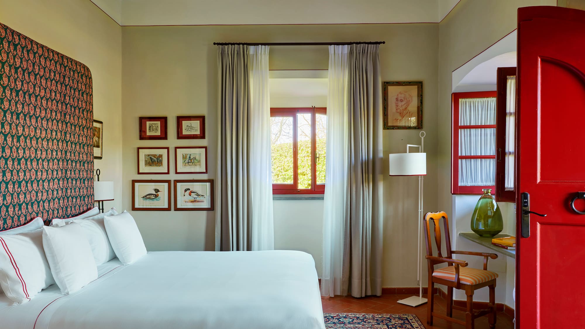 a bedroom with a bed and a chair