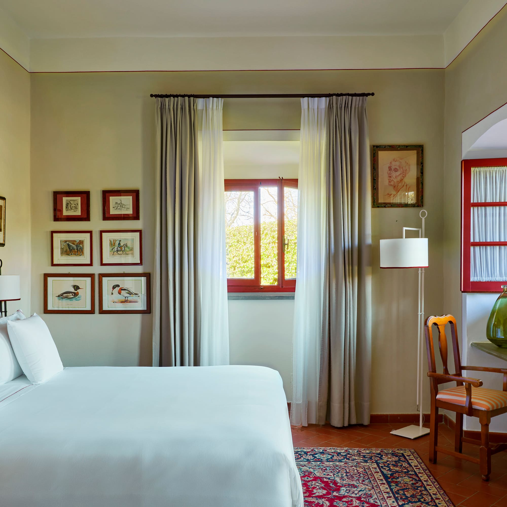 a bedroom with a bed and a chair